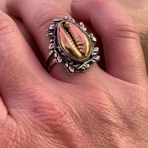 Sterling Silver statement ring with brass cowry shell.